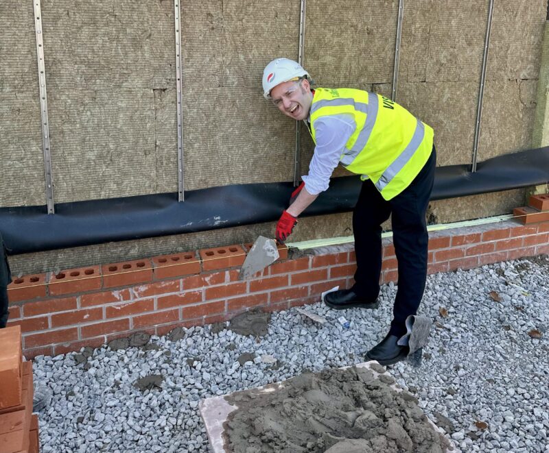 Tom trying bricklaying at Brentwood School