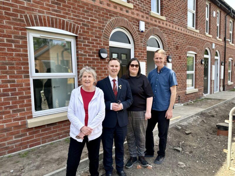 Tom with councillors at Shawe View in Flixton