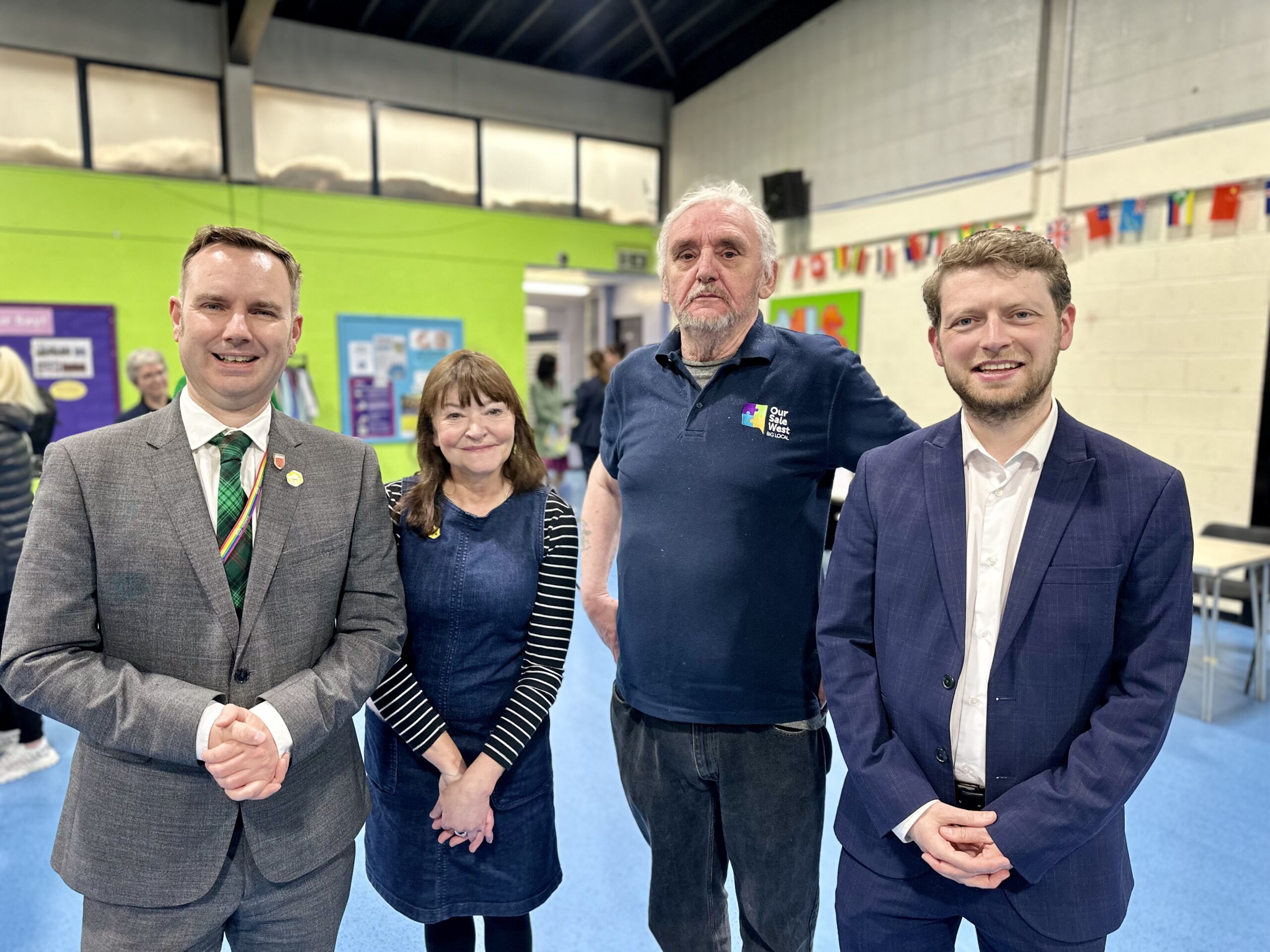 Tom with Rose Thompson, Ralph Rudden (Our Sale West) and Connor Rand MP at the Sale West Advice Hub