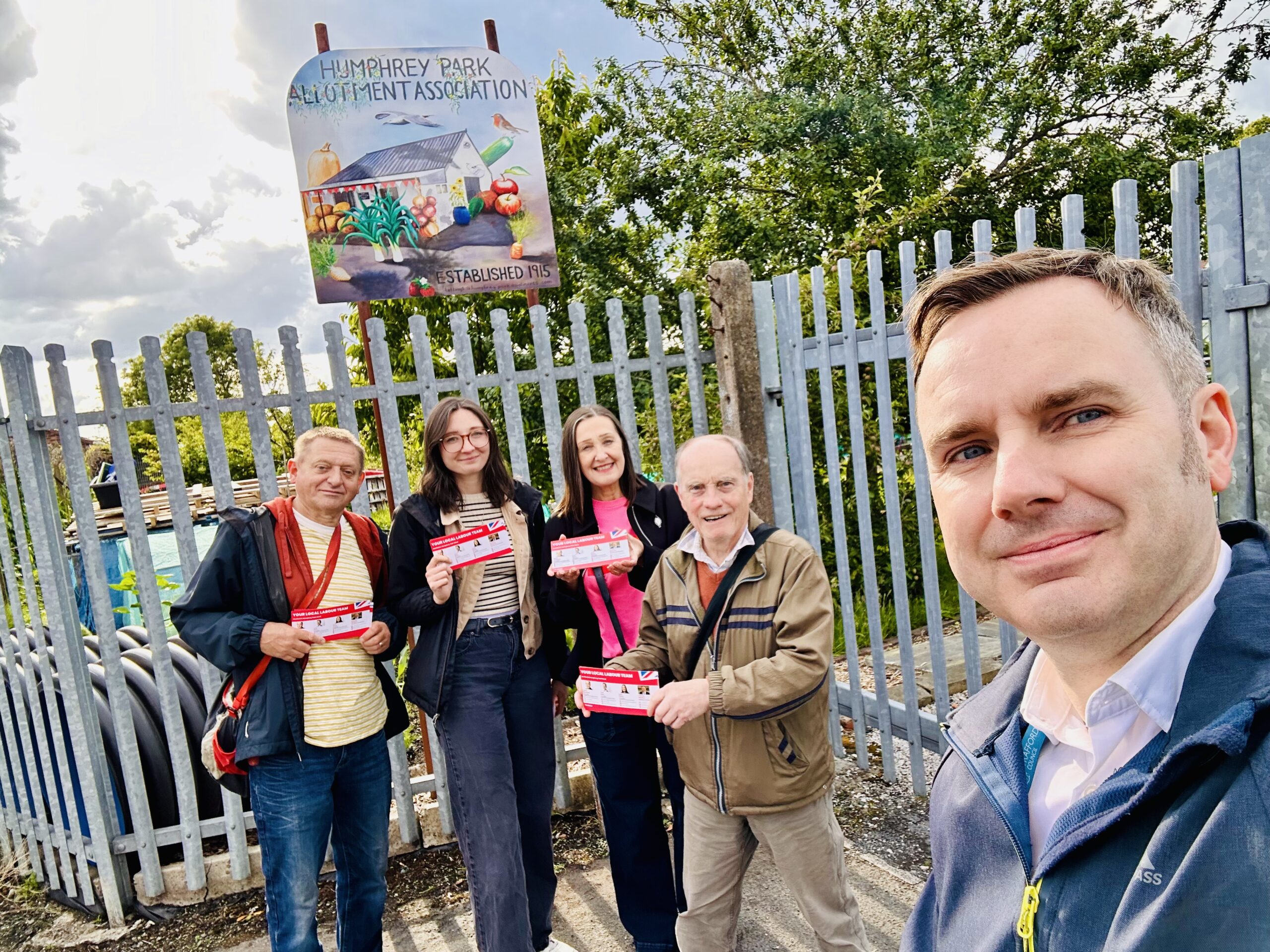 Tom on the doorstep with colleagues in Humphrey Park