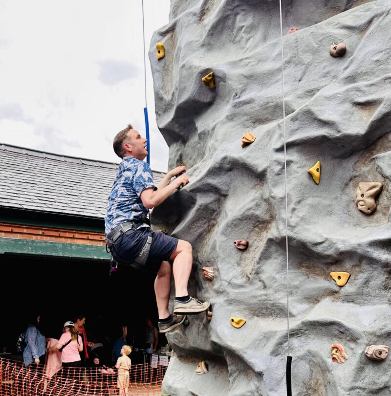 Tom on a climbing wall at Longford Scouts